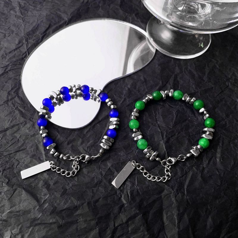 Den senaste omgången av designade kattögonstensarmband skarvade med INS trendiga handtillbehör titanstål obsidian herr- och damarmband_voghion.com