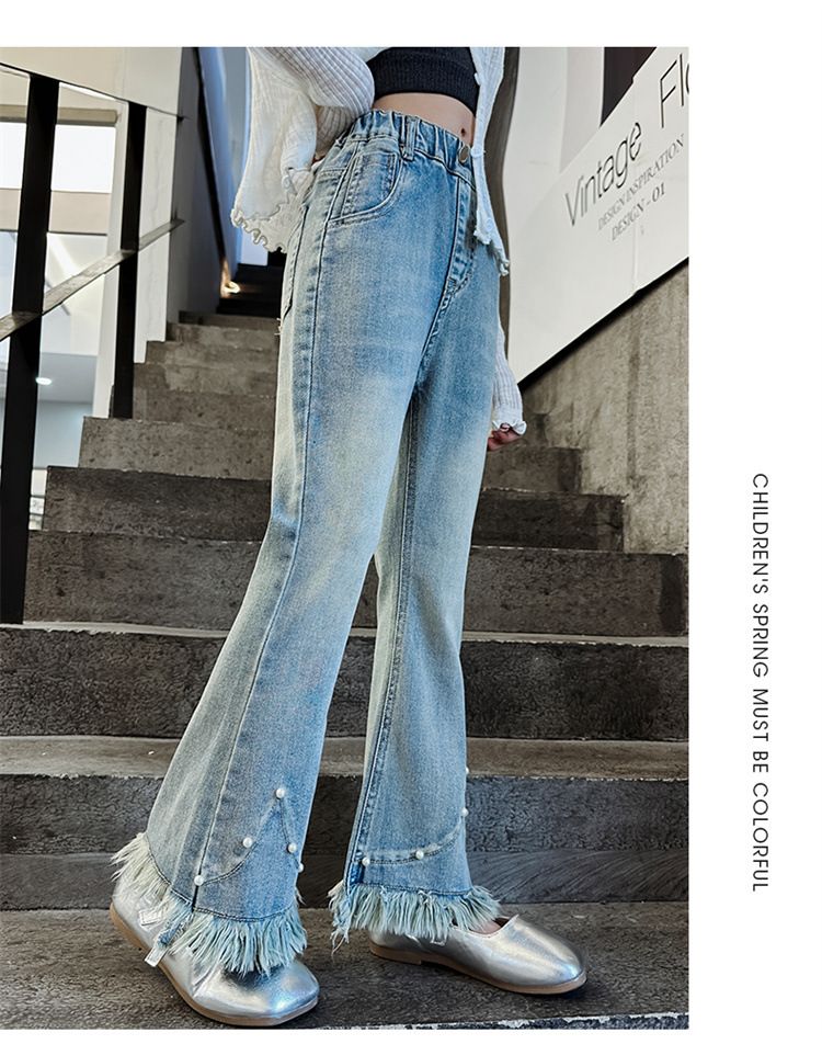 Ropa para niños Niñas 2024 primavera y otoño nuevos modelos para niñas medianas y grandes elegantes pantalones acampanados de mezclilla con borde sin rematar con borlas de perlas_voghion.com