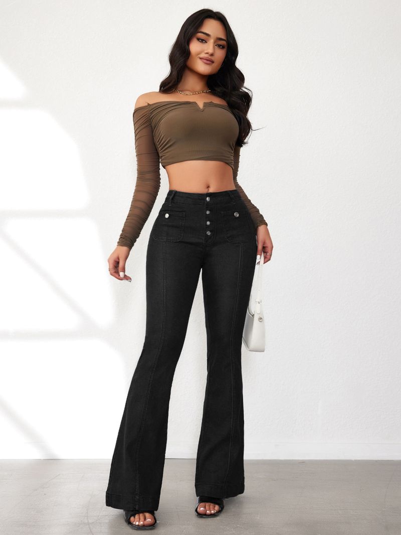zapinane na guziki jeansy typu bootcut dla kobiet z wysokim stanem i skrzyżowanymi nogawkami w magazynie_voghion.com