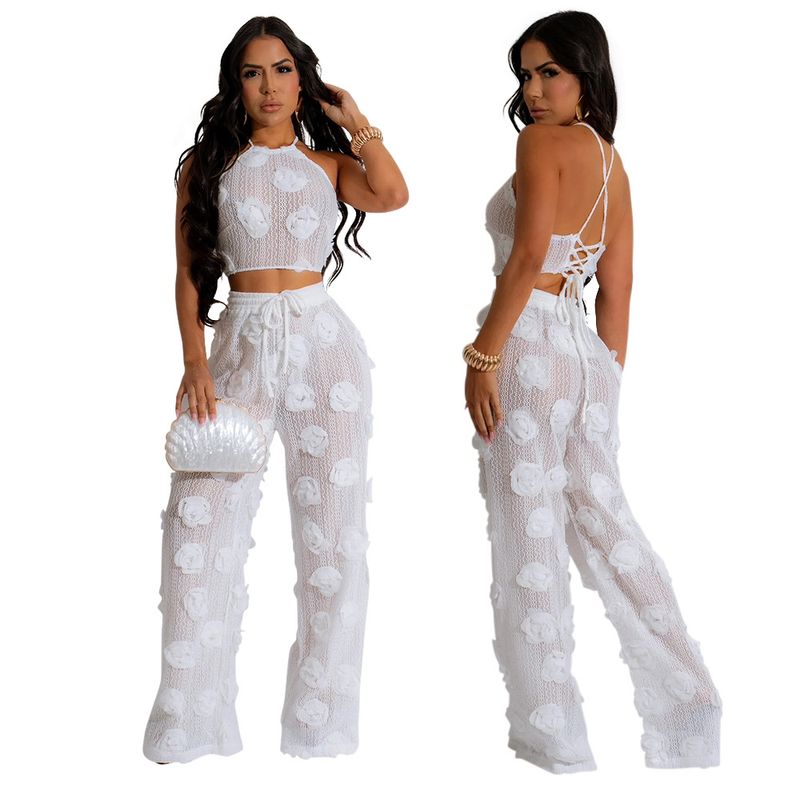 Completo due pezzi in tinta unita con top corto e pantaloni larghi e aderenti da donna_voghion.com