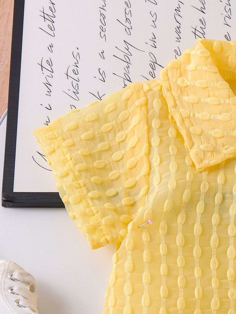 "Completo composto da maglietta gialla, gilet e pantaloncini per bambine dai 2 ai 7 anni - Completo in morbido cotone composto da 3 pezzi con eleganti stratificazioni"_voghion.com