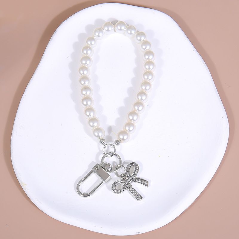 Mobile Phone Case Accessories Bow Diamond Pendant Glass Imitation Pearl Hand Held Bead Chain Short Chain Bag Pendant_voghion.com