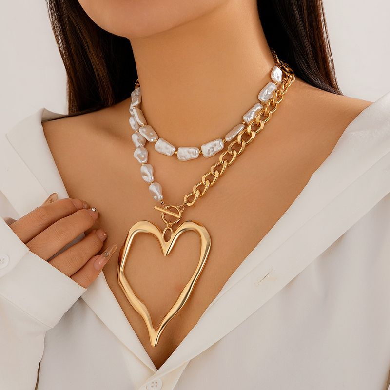 Elegante collana a doppio strato con cuore di lava esagerato in perle artificiali barocche_voghion.com