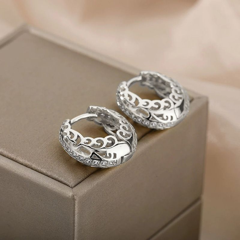 Cao Shi's hot selling with hollow out design, floral micro inlaid ear buttons, textured circles, geometric earrings_voghion.com