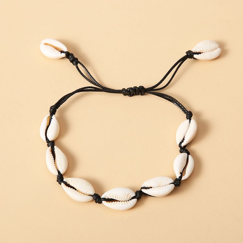 Beach style handcrafted black rope women's foot accessories with 9 shell anklets_voghion.com