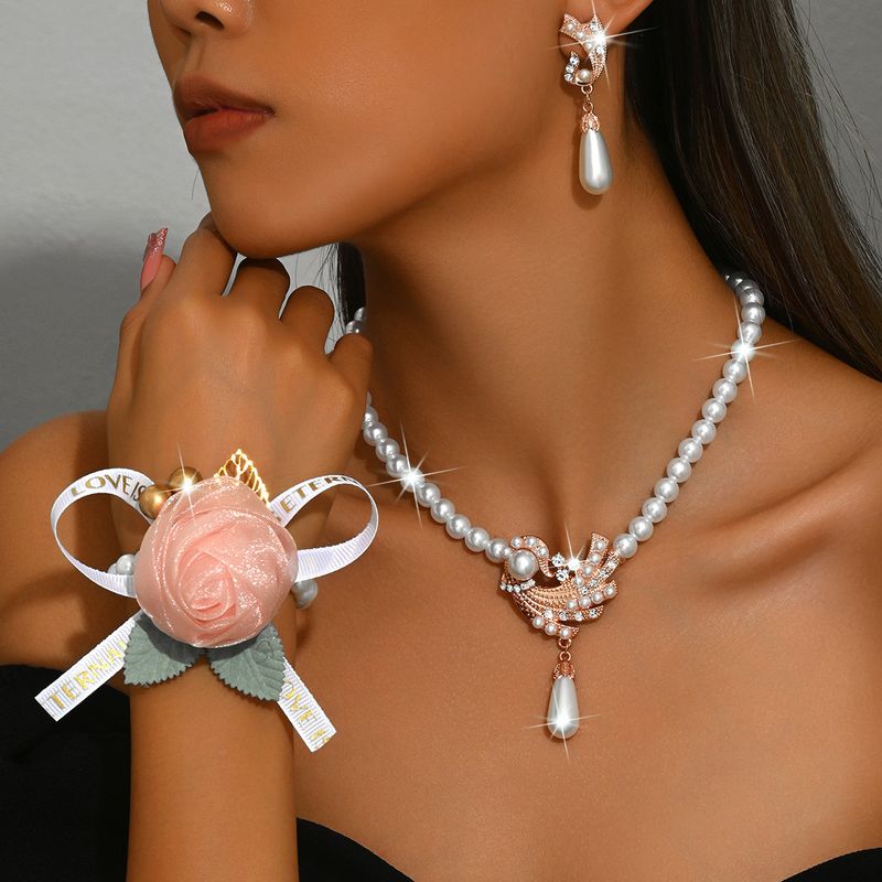 Set di gioielli da donna alla moda, collana di perle, orecchini, bracciale, set di fiori in lega, abito da sposa, personalità, temperamento alla moda femminile_voghion.com