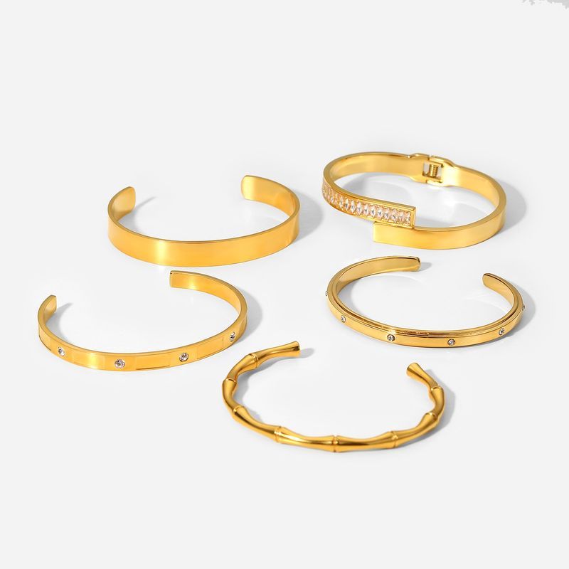 Conjunto INS Zircon aberto com pulseira de aço inoxidável galvanizada dourada estilo fashion para mulheres_voghion.com