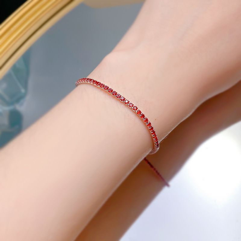 Bracciale Mujing Jewelry S in argento per donna, con catena da tennis color rosso sangue di piccione, con fila singola di zirconi intarsiati e diamanti._voghion.com