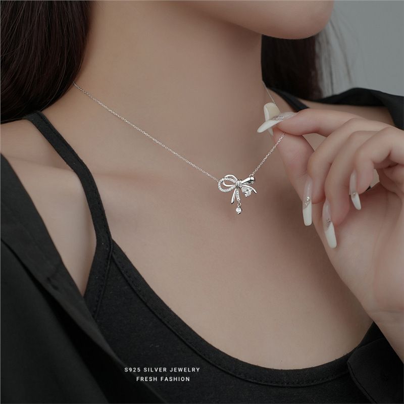 S silberne dynamische Schleifenhalskette für Frauen, leichter Luxus, süßes und nischenhaftes Temperament, Quaste, Wassertropfen, funkelnd_voghion.com