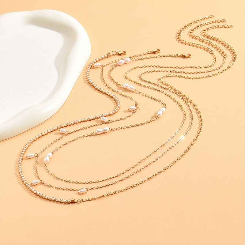 DZ0360 Chaîne de taille simple en perles de riz pour femme, style pastoral créatif_voghion.com