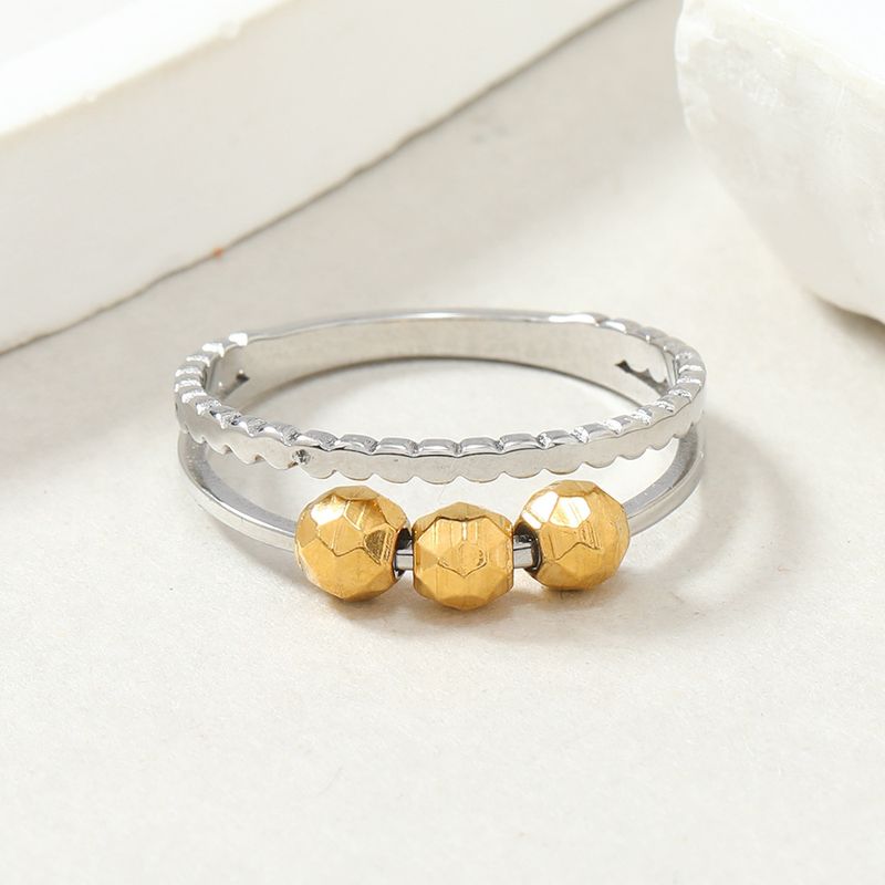 Anello in titanio alla moda con design di nicchia, anello a sfera mobile in acciaio a doppio strato cavo tagliato, accessorio di decompressione_voghion.com