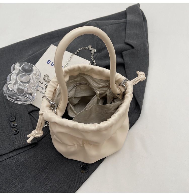 Korean high-end soft glutinous cloud bucket bag, niche pleated handbag, cute ins shoulder crossbody bag_voghion.com