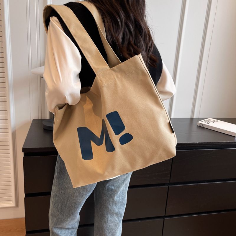 Bolso de mano de lona con cierre de cremallera para mujer, gran capacidad, versátil, de un solo hombro, para compras de supermercado, 2025_voghion.com