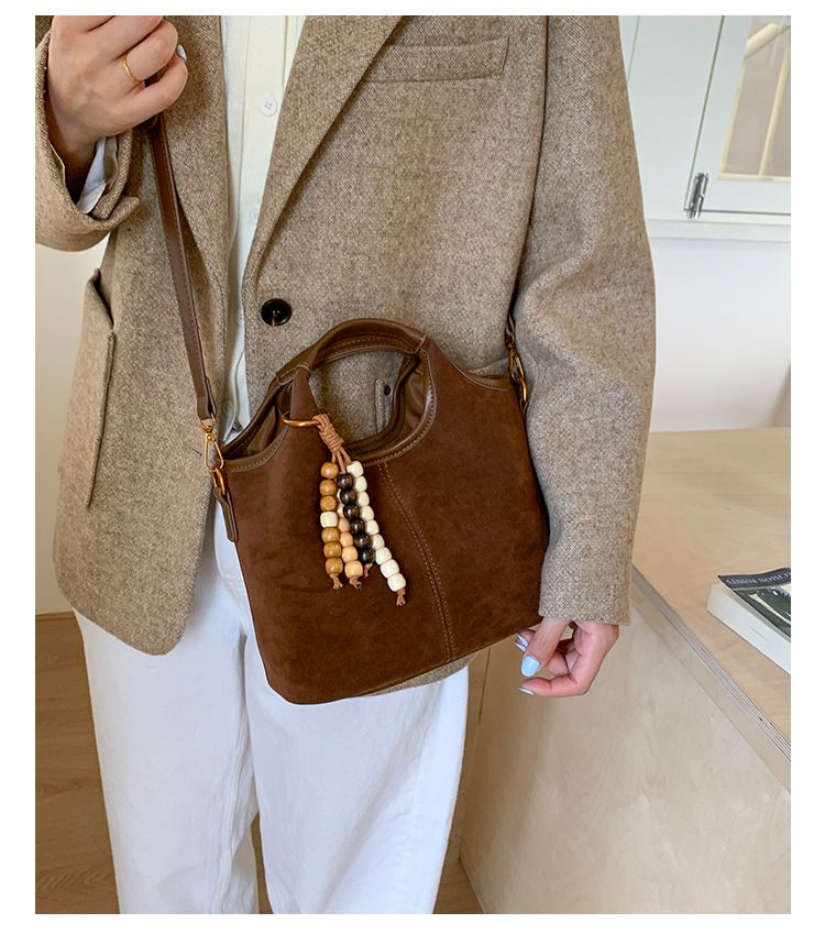 Borsa a secchiello con tracolla singola versatile in pelle scamosciata da donna, nuova moda 2025, borsa a mano Melad_voghion.com
