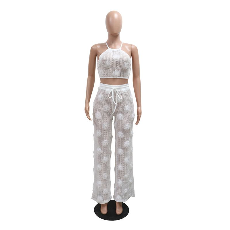 Completo due pezzi in tinta unita con top corto e pantaloni larghi e aderenti da donna_voghion.com