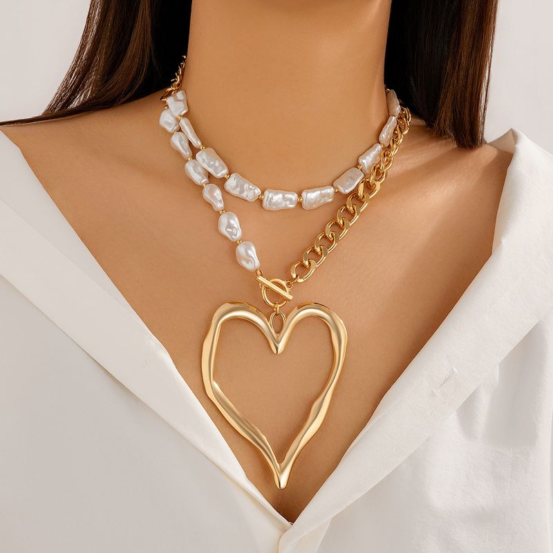 Elegante collana a doppio strato con cuore di lava esagerato in perle artificiali barocche_voghion.com