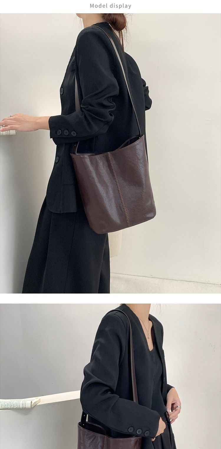 Hoofdlaag koeienhuid emmer 2024 nieuwe minimalistische stijl handgemaakte gestikte leren tas, enkele schouder crossbody tas voor_voghion.com