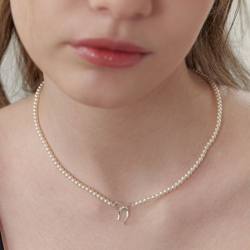 Damenschmuck, handgefertigt, Perlenkette mit Schleife, Fliege, geknoteter Anhänger, echt vergoldet, farbechte Halskette_voghion.com