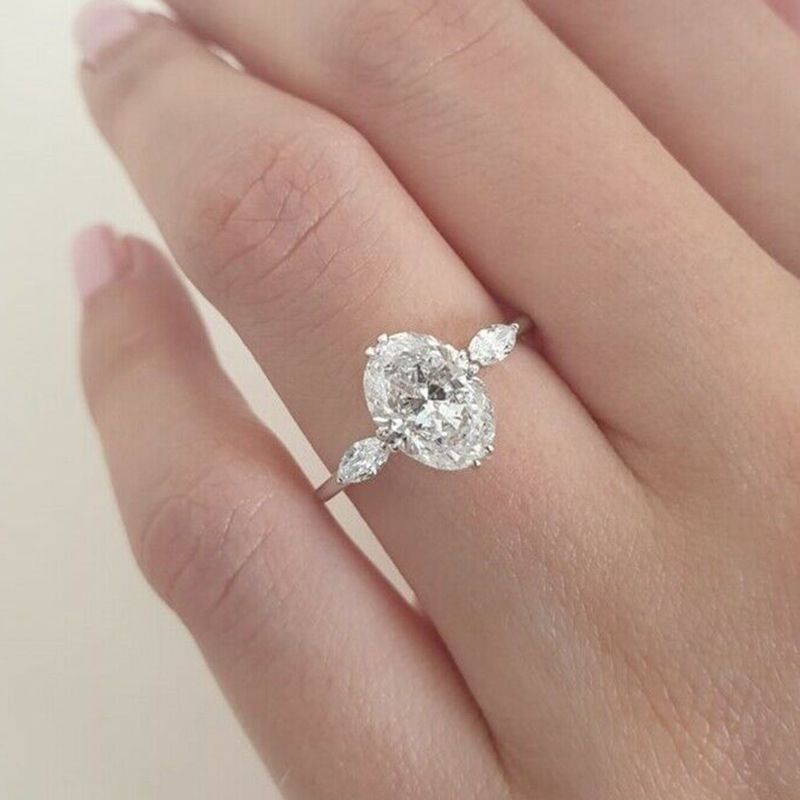 Nuovo anello di fidanzamento da donna con zircone ovale da 10 * 14 mm di Cao Shi, in maglia rossa._voghion.com