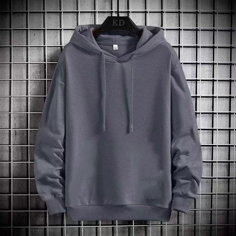 Una maglietta con cappuccio, ampia e alla moda, da indossare come strato base per gli uomini in primavera e autunno, in un semplice colore unito e casual a maniche lunghe._voghion.com