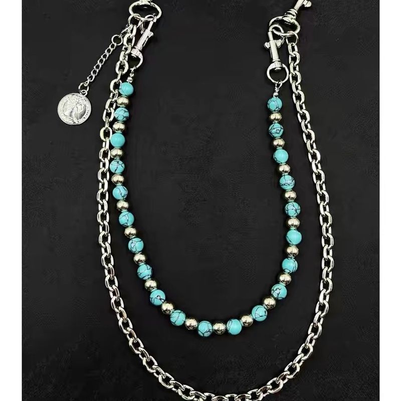 Pantalon en perles turquoise fait main, fond bleu, motif noir, chaîne de taille détachable sur un seul côté, artisanat lourd_voghion.com