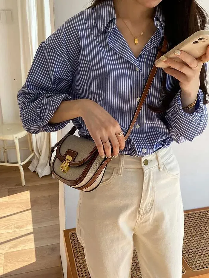 2025 New Small Style Contrast Hot Panel Canvas Retro One Shoulder Crossbody Saddle Bag_voghion.com