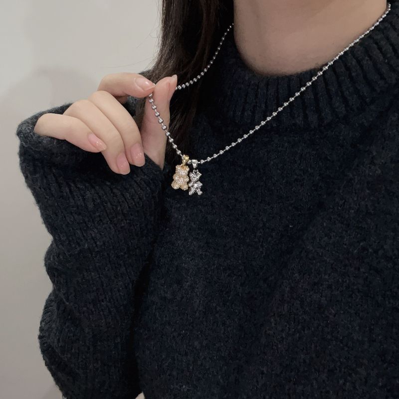 Collana con ciondolo a forma di orso con zircone intarsiato micro in titanio, design di nicchia, moda, collana versatile, catena per maglione_voghion.com