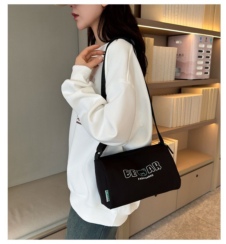2024 New Casual Shoulder Women's Oxford Cloth Large Capacity Lightweight Pillow Black Minimalist Printed Crossbody Bag_voghion.com