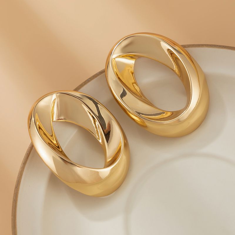 Personality metal geometric texture hollow earrings female irregular twisted glossy earrings earrings_voghion.com