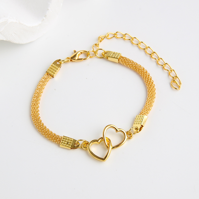 Nuovo braccialetto in argento lucido intrecciato con design creativo a doppio cuore_voghion.com
