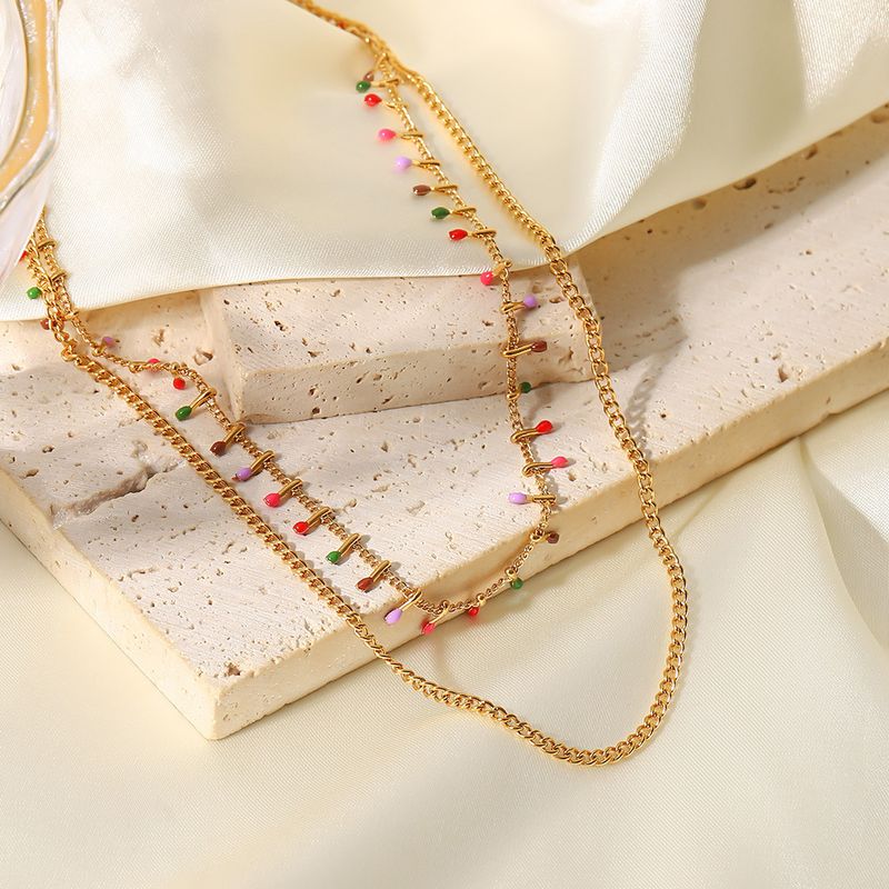 Collana in titanio francese INS nuova placcata in oro con catena cubana a doppio strato in acciaio inossidabile con nappa smaltata e affascinante collana_voghion.com