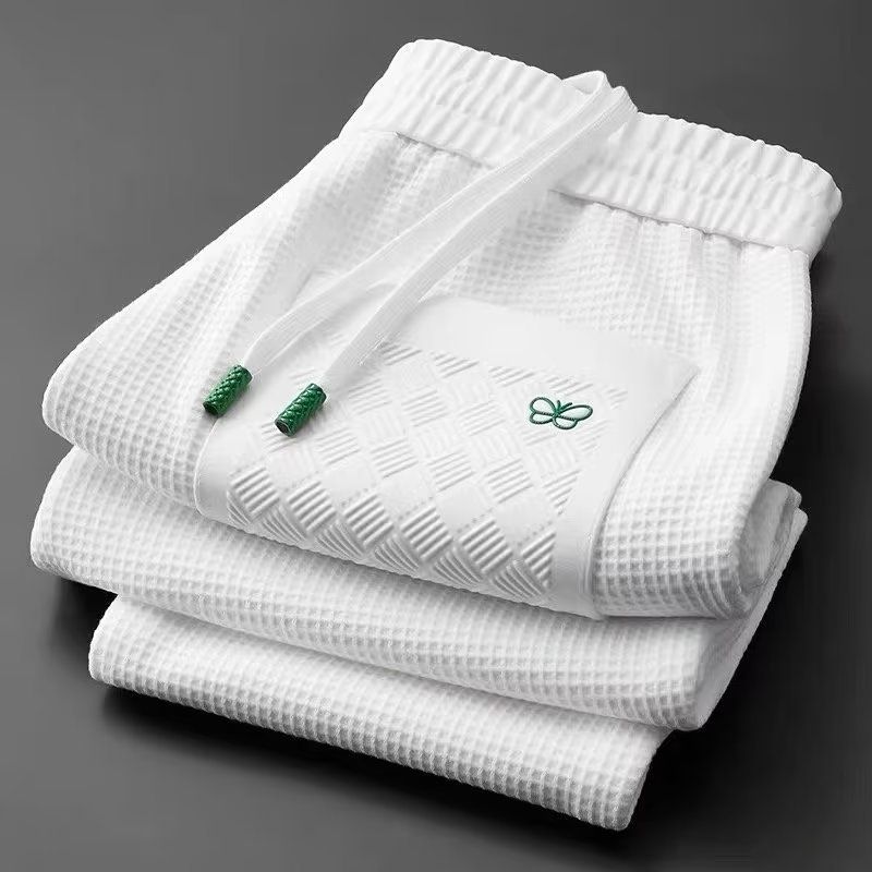 Pantalones casuales de punto gofre con diseño de mariposa para hombre - Joggers ajustados con puños elásticos para primavera y otoño - Pantalones deportivos ligeros y transpirables_voghion.com