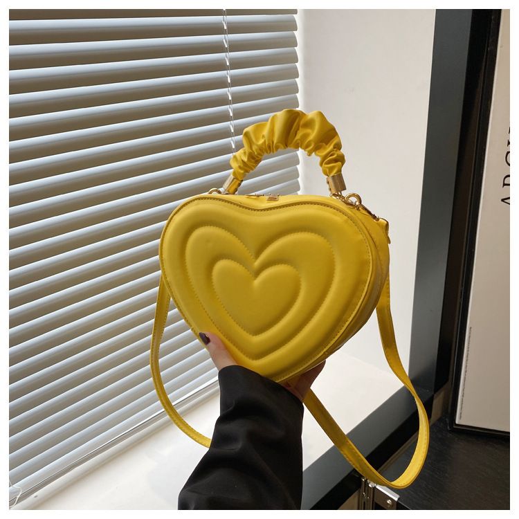 Indentatura semplice a forma di cuore carina tinta unita femminile cuore shopping moda plissettata borsa a tracolla_voghion.com