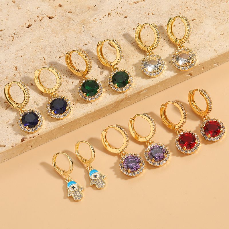 1 paio di orecchini pendenti eleganti e semplici in stile Commute Round Palm Eye con intarsi in smalto e zirconi in rame placcati in oro 14K_voghion.com