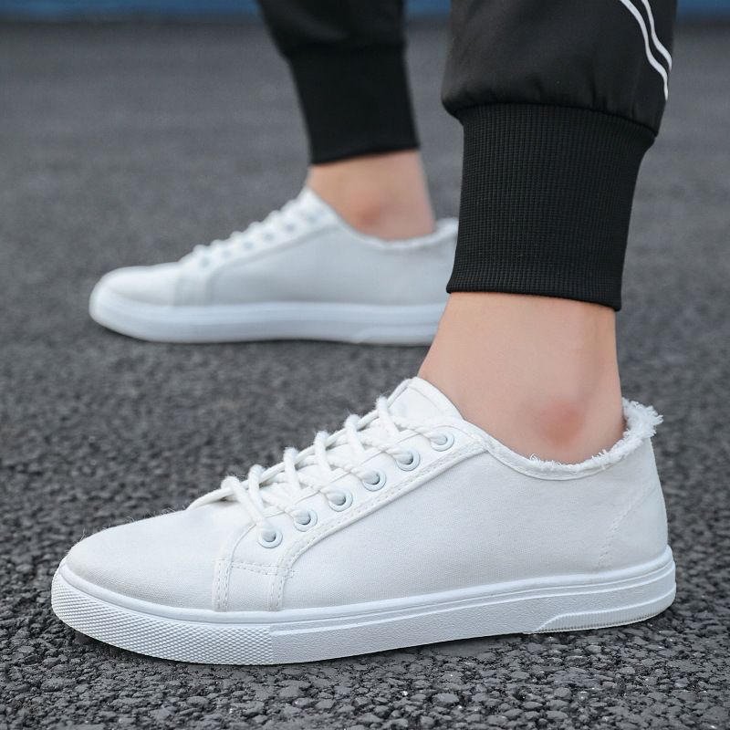 Scarpe da uomo in tela, scarpe bianche basse con suola morbida, alla moda e casual, con un solo piede, versione coreana per studenti, alla moda._voghion.com