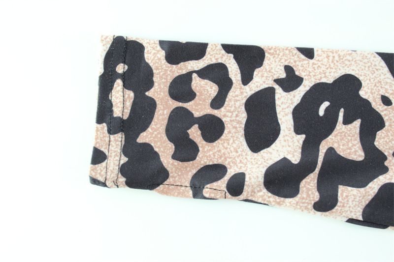 Tuta da donna con stampa leopardata, maniche lunghe, design traforato e vestibilità slim (S-L, pronta per l'estate)_voghion.com