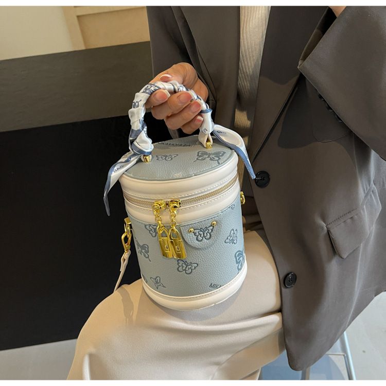 Borsa da donna retrò con motivo a farfalla, borsa a secchiello con colori a contrasto, borsa cilindrica da donna, borsa a tracolla con texture alla moda, design di nicchia_voghion.com