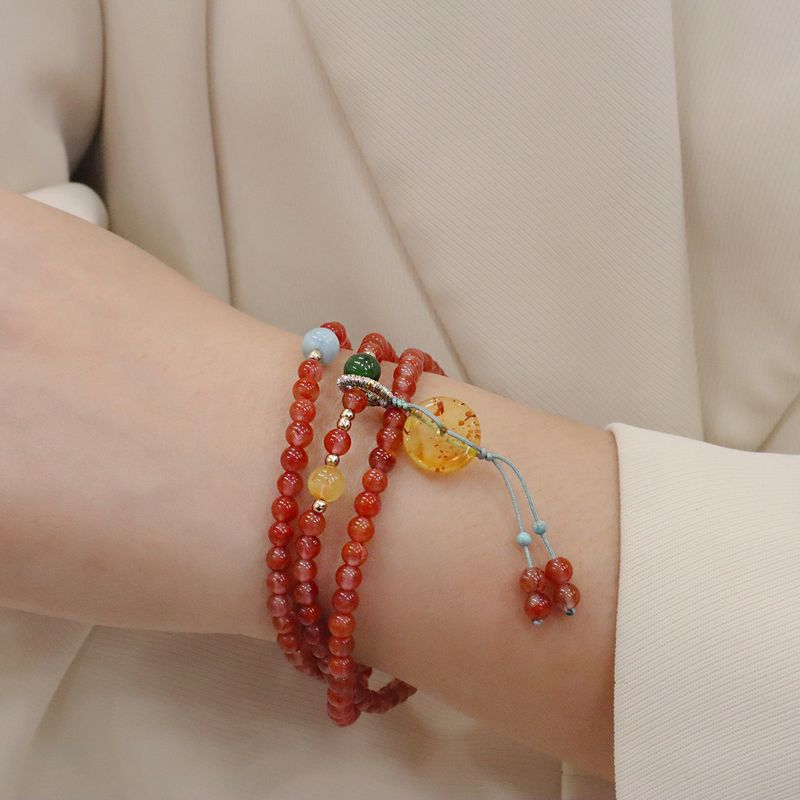 Braccialetto multistrato in cera d'api e ambra | Fibbia della pace e design mughetto | Nicchia di lusso leggera, galleggiante sul ghiaccio, rosso del sud_voghion.com