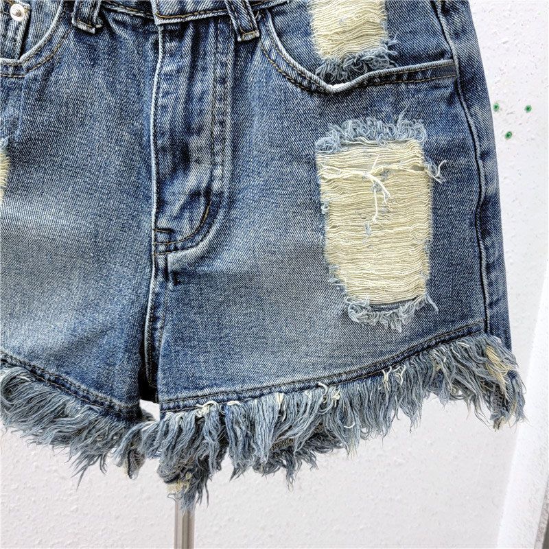 Obnošené džínové kraťasy, dámské tenké letní instagramové stylové široké nohavice s pikantními volánky a áčkovým vzorem_voghion.com