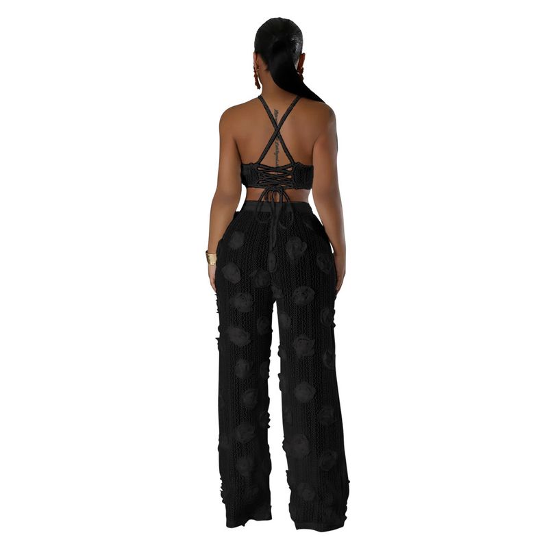 Completo due pezzi in tinta unita con top corto e pantaloni larghi e aderenti da donna_voghion.com
