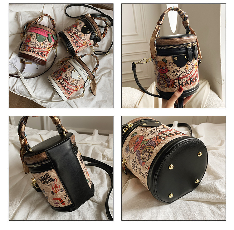 Graffiti bucket in 2024, new fashionable niche cylindrical bag, handheld one shoulder crossbody bag for women_voghion.com