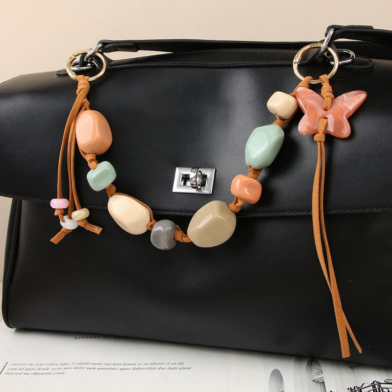 Ciondolo per borsa a forma di farfalla in stile bohémien, realizzato a mano: pendente con frange in resina e perline, con nappe, per borse, zaini e portachiavi (blu/verde artigianale)_voghion.com