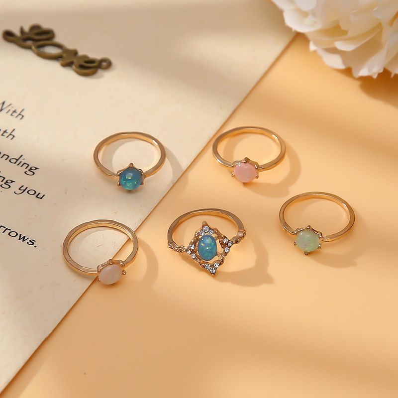 Neues modisches 5-teiliges Set mit Ringen aus Opalimitat in Bonbonfarben_voghion.com