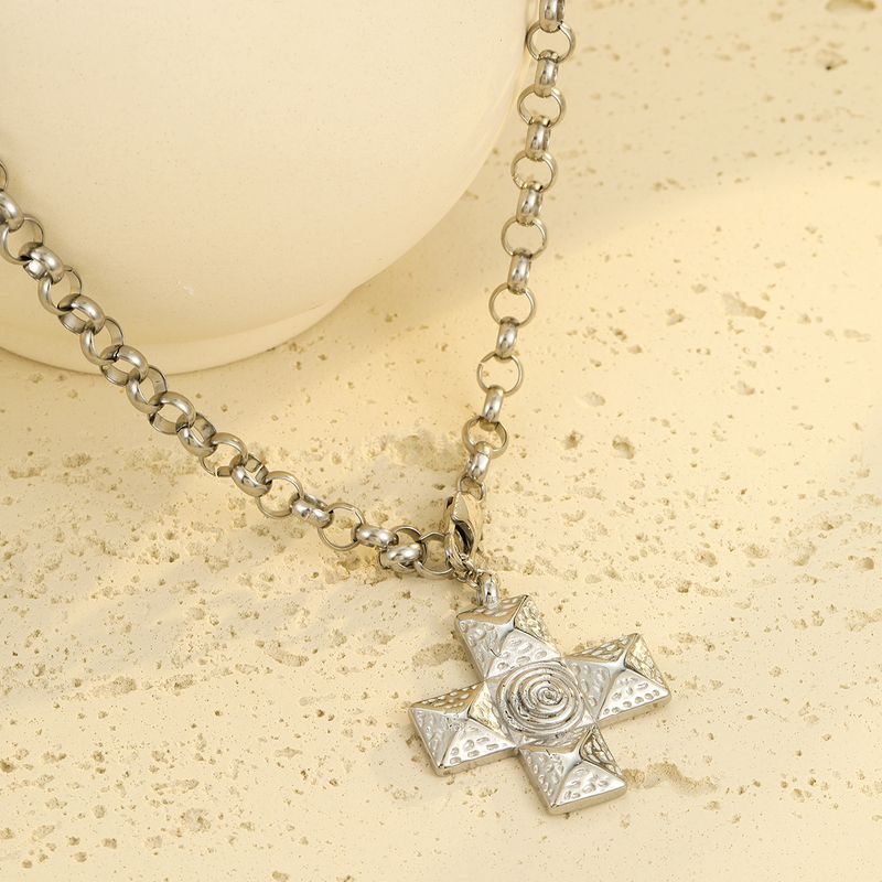 Collier INS polyvalent haut de gamme en acier inoxydable, métal titane, texture spirale et croix. Bijou_voghion.com