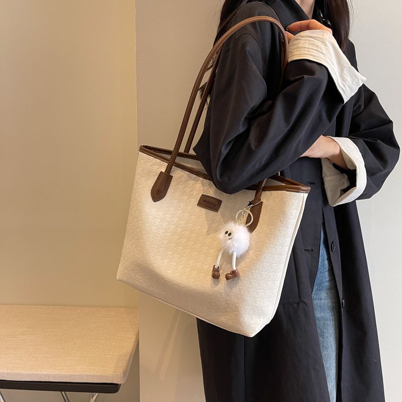 Grote capaciteit voor vrouwen 2025 Nieuwe casual kantoor schoudertas High-end gevoel College student klas forenzen tas_voghion.com