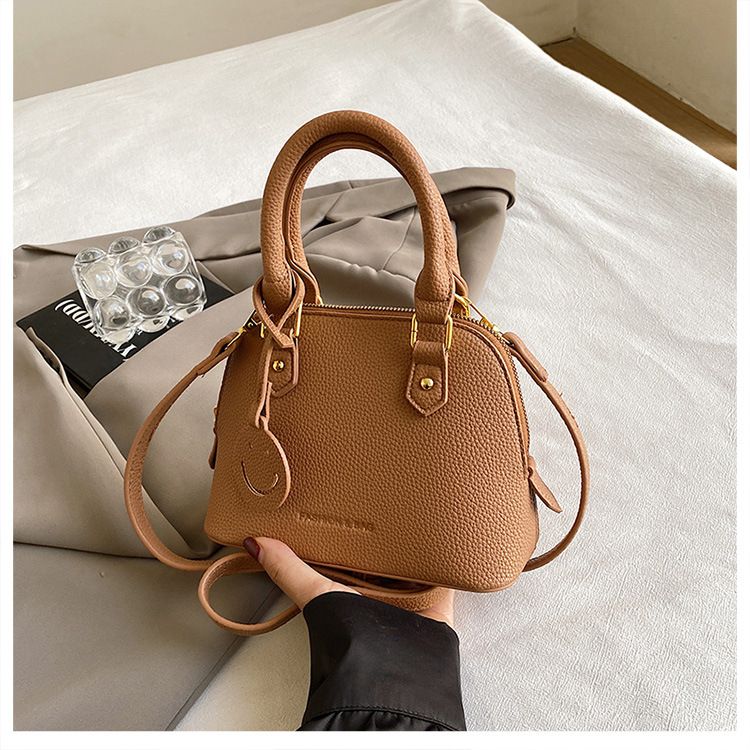 Trendy temperament solid color hand-held shell 2024 new high-end multi-color single shoulder crossbody women's bag_voghion.com