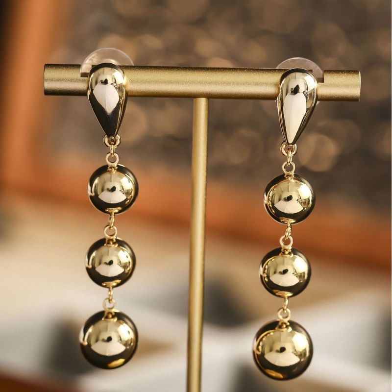 Orecchini a tre sfere lucide in rame placcato oro, stile minimalista, con nappe, orecchini a polsino con perline rotonde di alta qualità e design creativo per donna_voghion.com