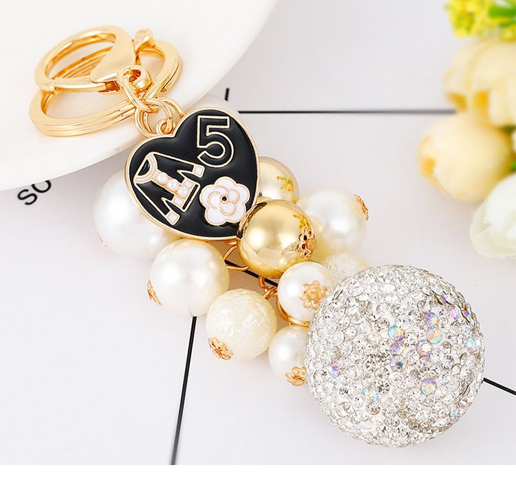 Exquisite diamond studded round pearl string small fragrance keychain clothes 5-character metal decoration bag pendant_voghion.com