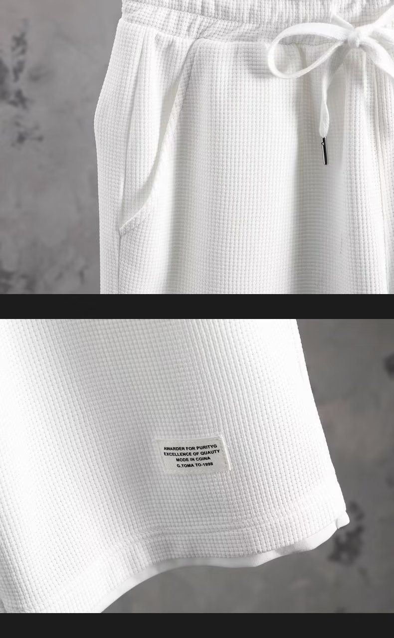 Pantaloncini a maniche corte da uomo all'ingrosso, larghi, finti due pezzi, a pois_voghion.com