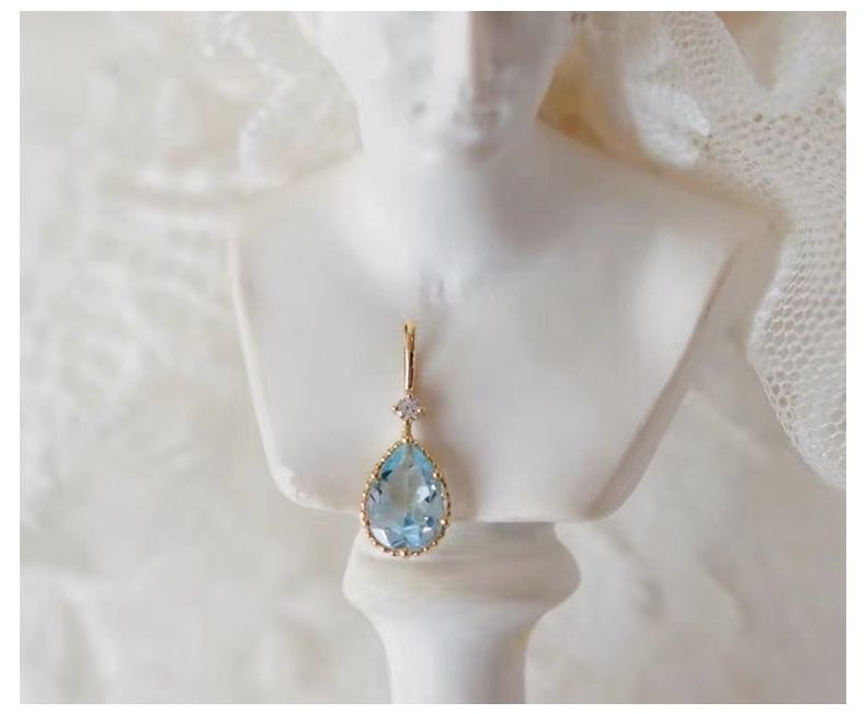 Collier haut de gamme en forme de goutte d'eau avec pendentif en topaze bleu ciel plaqué argent pur 14 carats_voghion.com